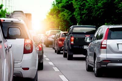 Cars on the road heading towards the goal of the trip. tourism A