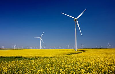 Wind turbines on fields with windmills in the Romanian region Do