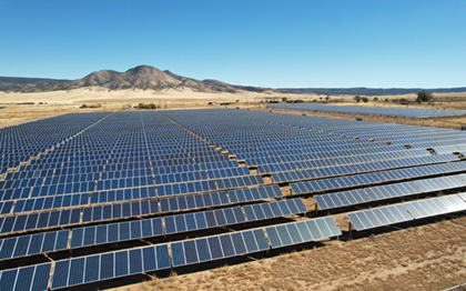 Aerial drone shot of a large solar array power plant in the dese