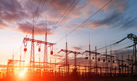 Silhouette High voltage electric tower on sunset time and sky on sunset time background.
